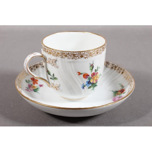 262 - KPM cabinet cup and saucer with gilt rim and floral decoration.
