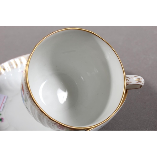 262 - KPM cabinet cup and saucer with gilt rim and floral decoration.