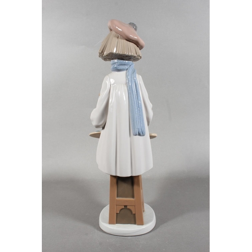 267 - Nao figure of a girl artist with easel, 34cm tall.