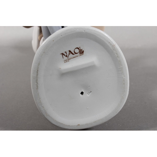 267 - Nao figure of a girl artist with easel, 34cm tall.