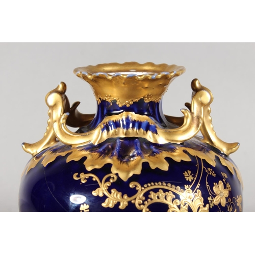 277 - Limoges for Maple and Co London vase with blue ground and elaborate gilt decoration, 19cm tall.