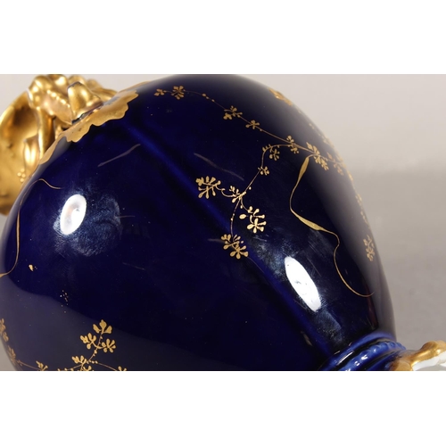 277 - Limoges for Maple and Co London vase with blue ground and elaborate gilt decoration, 19cm tall.