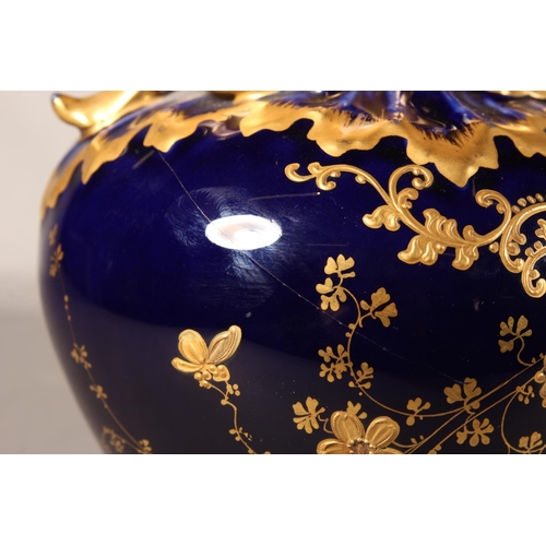 277 - Limoges for Maple and Co London vase with blue ground and elaborate gilt decoration, 19cm tall.