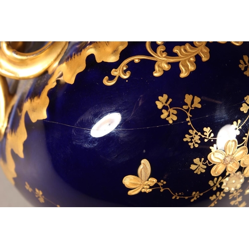 277 - Limoges for Maple and Co London vase with blue ground and elaborate gilt decoration, 19cm tall.