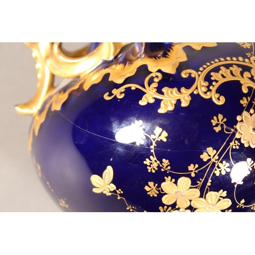 277 - Limoges for Maple and Co London vase with blue ground and elaborate gilt decoration, 19cm tall.
