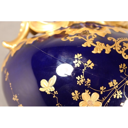 277 - Limoges for Maple and Co London vase with blue ground and elaborate gilt decoration, 19cm tall.