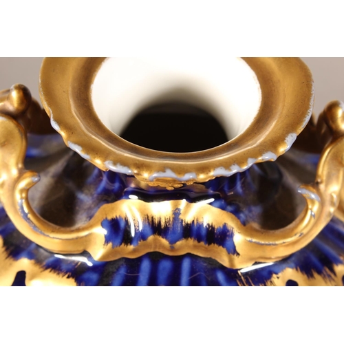 277 - Limoges for Maple and Co London vase with blue ground and elaborate gilt decoration, 19cm tall.