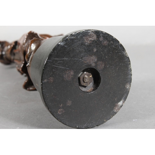 288 - Bronze effect sculpture of a girl with fish basket on stand, 30cm tall.