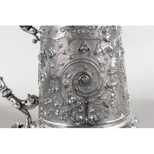 294 - Late 19th Century WMF silver plated tankard with elaborate decoration, 30cm tall.