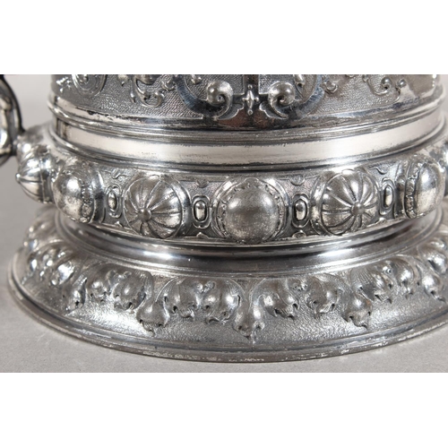 294 - Late 19th Century WMF silver plated tankard with elaborate decoration, 30cm tall.