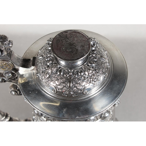 294 - Late 19th Century WMF silver plated tankard with elaborate decoration, 30cm tall.