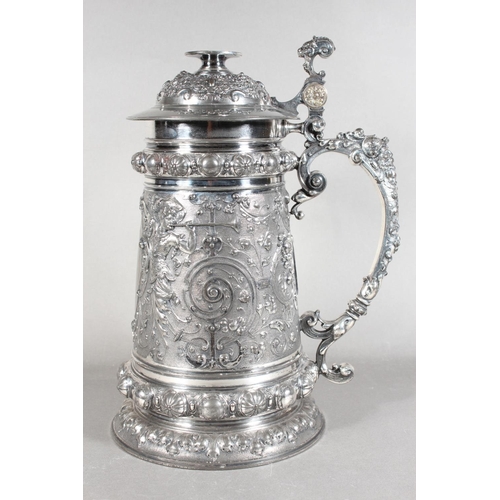 294 - Late 19th Century WMF silver plated tankard with elaborate decoration, 30cm tall.