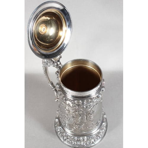 294 - Late 19th Century WMF silver plated tankard with elaborate decoration, 30cm tall.