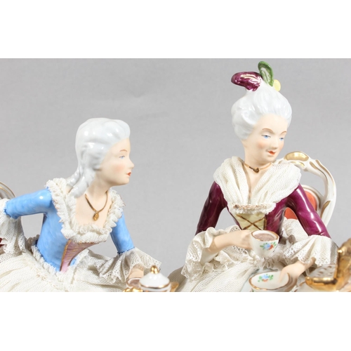 10C - Dresden of Germany figure group depicting a Victorian tea scene.