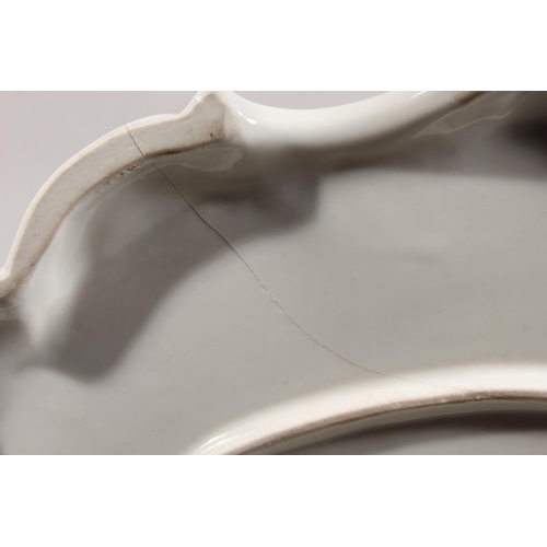 10C - Dresden of Germany figure group depicting a Victorian tea scene.