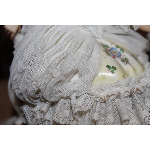 10C - Dresden of Germany figure group depicting a Victorian tea scene.