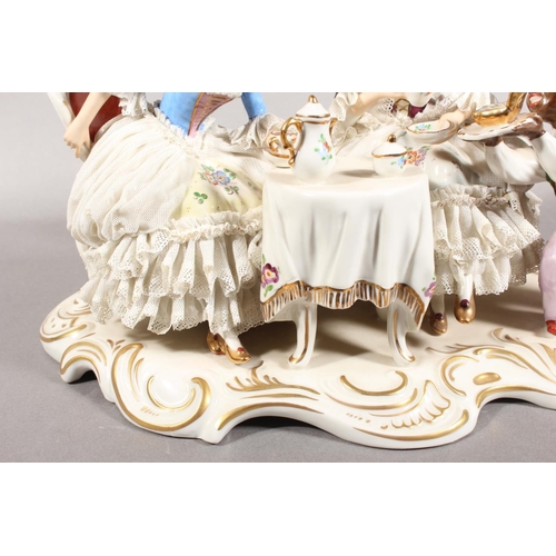 10C - Dresden of Germany figure group depicting a Victorian tea scene.