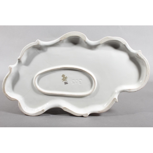 10C - Dresden of Germany figure group depicting a Victorian tea scene.