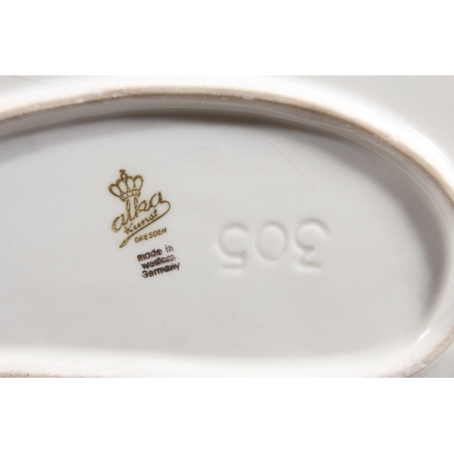 10C - Dresden of Germany figure group depicting a Victorian tea scene.