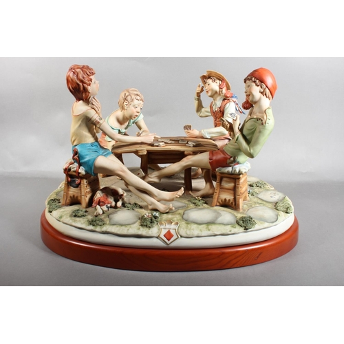 10D - Capo di monte figure group 'The Cheat', signed to base.