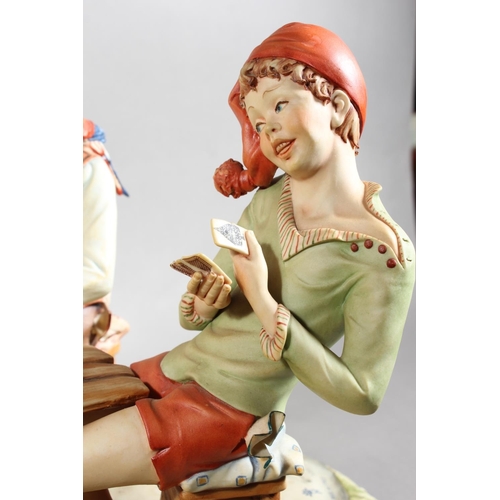 10D - Capo di monte figure group 'The Cheat', signed to base.