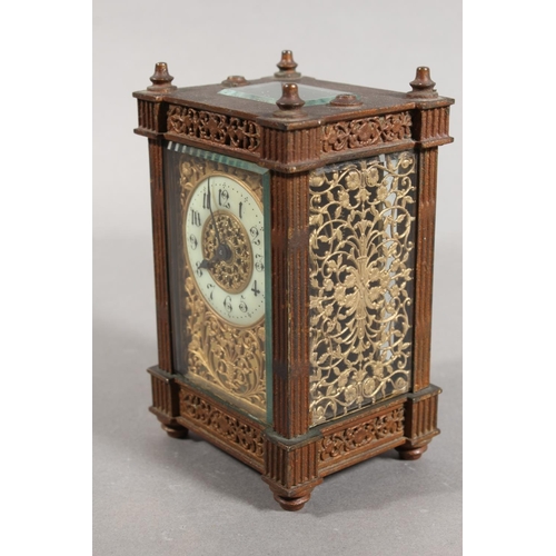 11 - Antique brass and four glass carriage clock, with white enamelled dial.