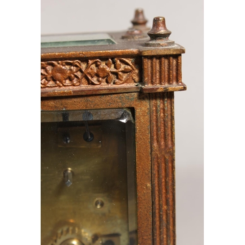 11 - Antique brass and four glass carriage clock, with white enamelled dial.