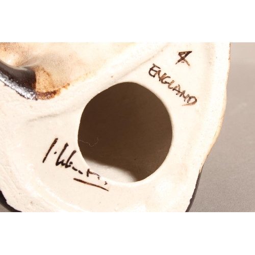 15 - Four Winstanley pottery Siamese cats with blue eyes, largest 26cm high.