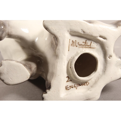 17 - Winstanley pottery Siamese cat with blue eyes, 20cm high.