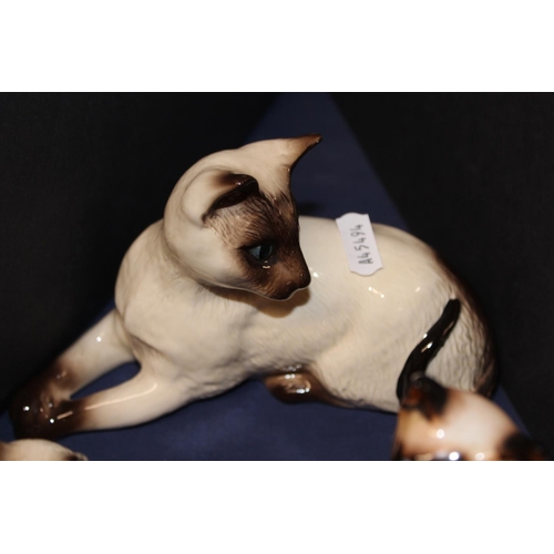 18 - Royal Doulton Siamese cat models to include a flamb&eacute; Siamese cat group.&nbsp; (7)