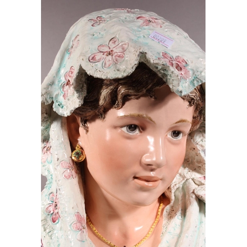 21 - Porcelain female bust in Victorian dress with locket, 50cm high.