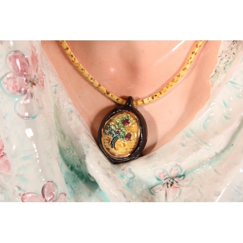21 - Porcelain female bust in Victorian dress with locket, 50cm high.