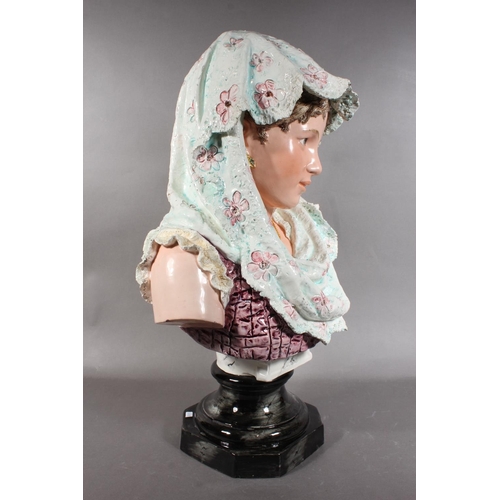 21 - Porcelain female bust in Victorian dress with locket, 50cm high.