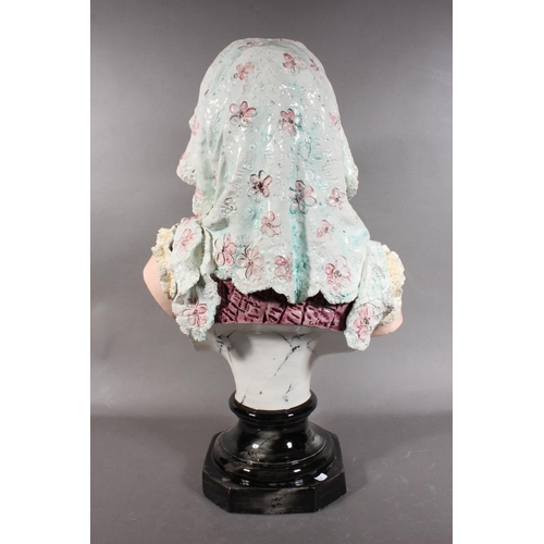 21 - Porcelain female bust in Victorian dress with locket, 50cm high.