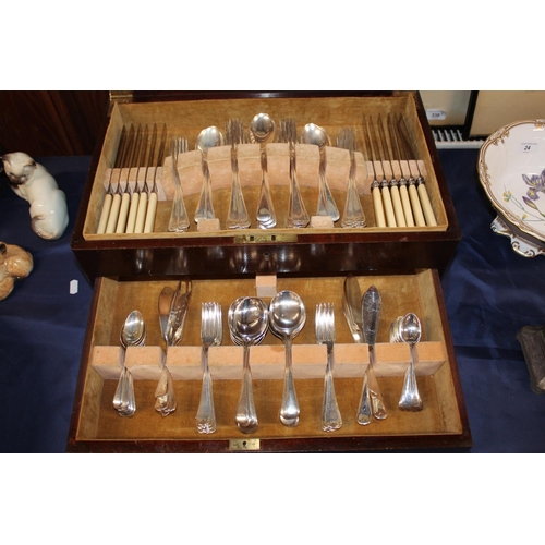 23 - Cased part canteen of silver-plated flatware.
