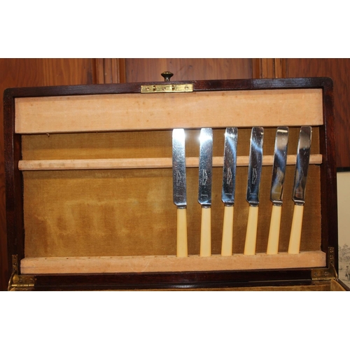 23 - Cased part canteen of silver-plated flatware.