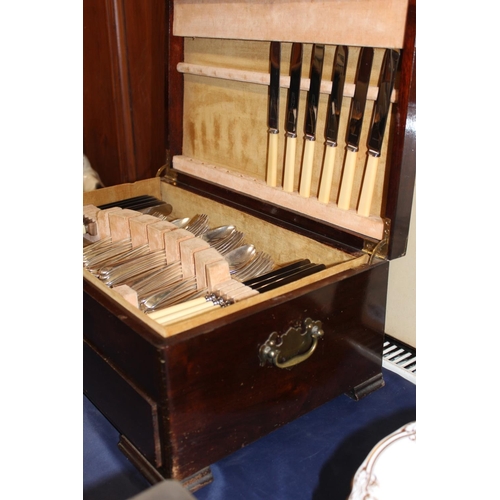 23 - Cased part canteen of silver-plated flatware.