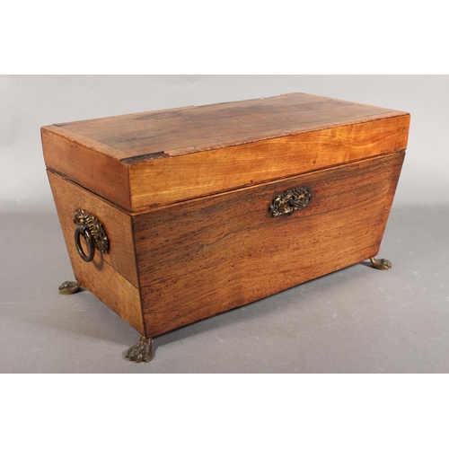 28 - Victorian tea caddy, raised on brass paw supports.