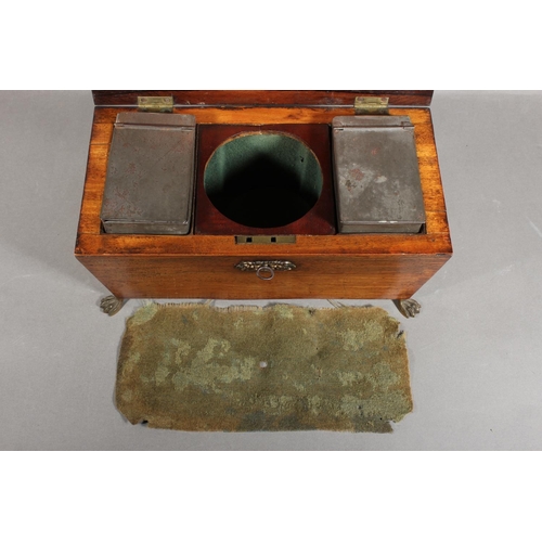 28 - Victorian tea caddy, raised on brass paw supports.