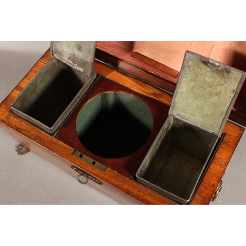 28 - Victorian tea caddy, raised on brass paw supports.