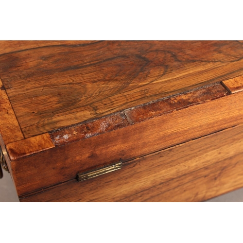 28 - Victorian tea caddy, raised on brass paw supports.