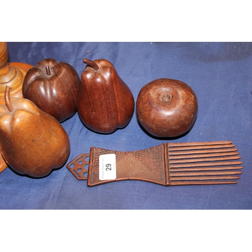 29 - Pair of turned candlesticks, wooden fruit and an African style comb.
