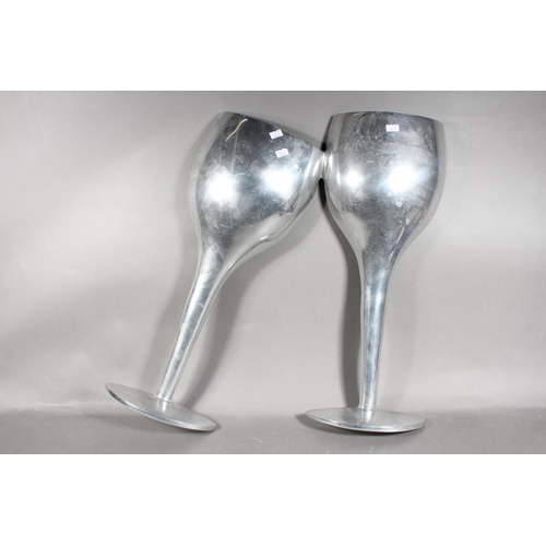 37 - Pair of aluminium large decorative champagne flutes, 55cm high.