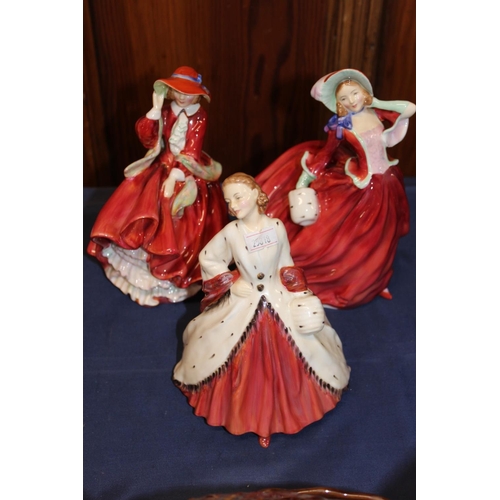 38 - Royal Doulton HN1981 The Ermine Coat, HN1834 Top O' The Hill, and HN1835 Autumn Breezes.