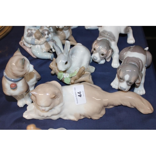 44 - Lladro dog models and groups, a Nao cat model, a Lladro rabbit, etc.
