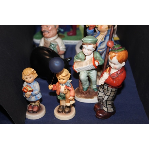58 - Decorative ceramics to include Hummel figures, a Wade Andy Capp money box, a Cardew Collectors Club ... 