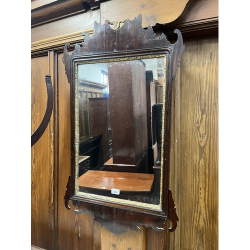 529 - Antique mahogany framed fret carved wall mirror, 95cm x 56cm.