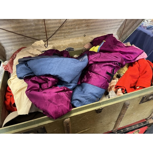 548 - Two wood-bound trunks and contents, and another red trunk.