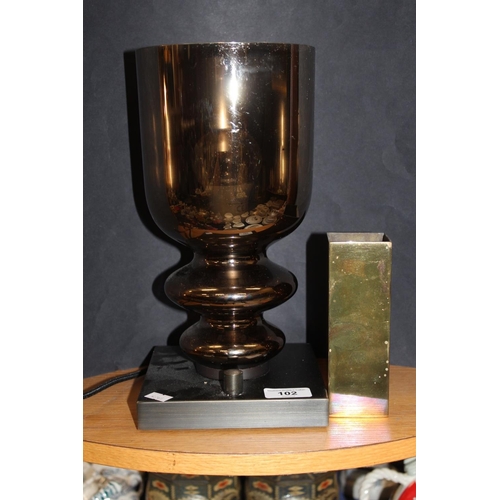 102 - Modern table lamp and a solid brass column vase by S H.