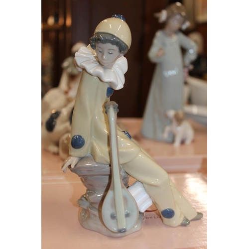 106 - Five Nao figures, boxed, to include a clown, a dog group, etc.